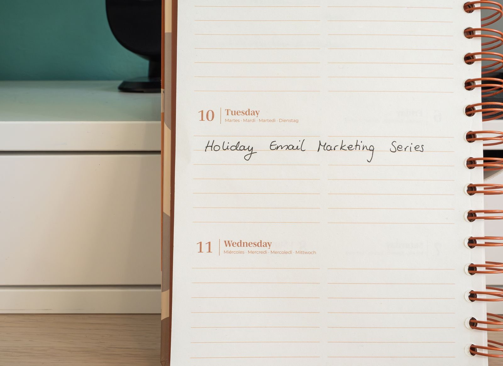 A calendar planner organizes tasks and deadlines for a loyalty program launch.
