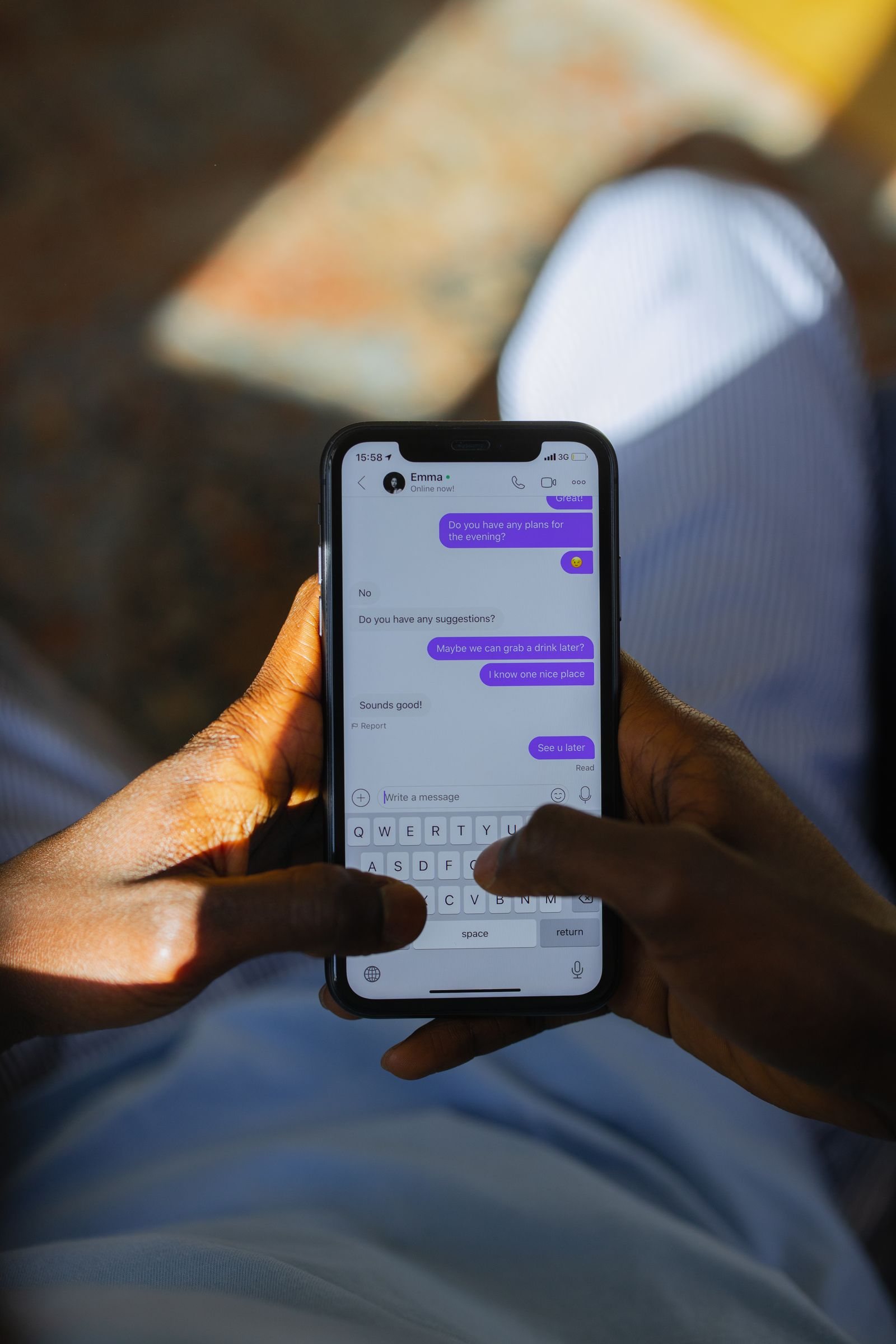 A person types a message on a smartphone.