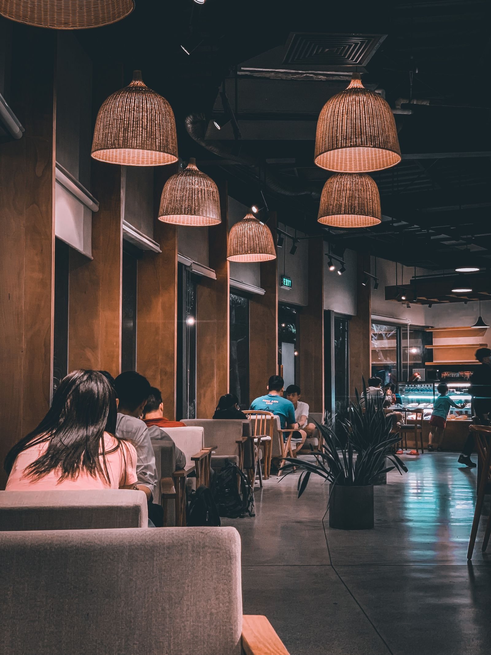 Guests dining in a warm modern restaurant interior.